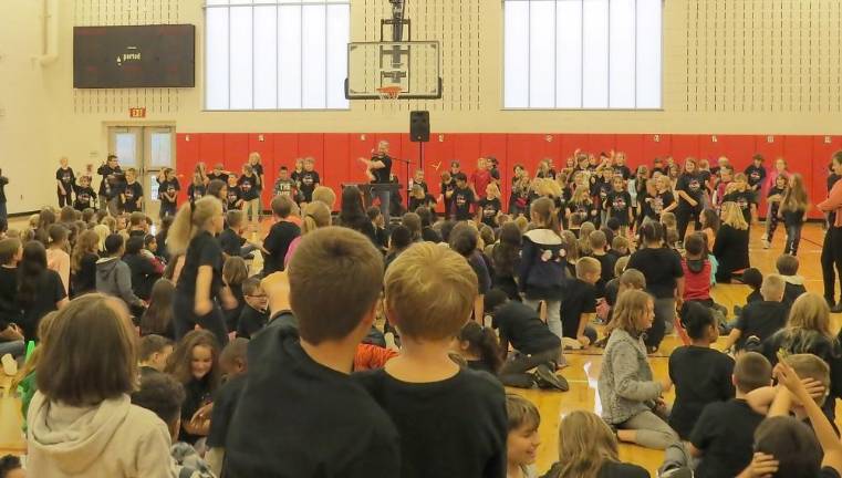 Producer and composer teaches kids about more than music The entire school danced to their song.