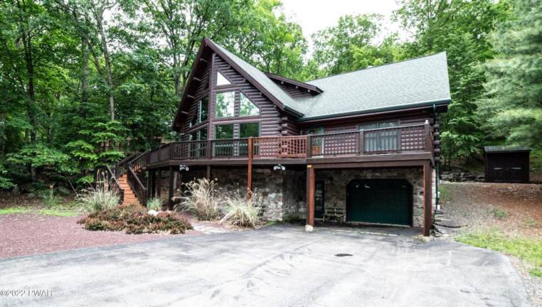 Furnished, spacious log and stone cabin is move-in ready