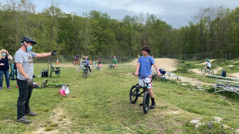 West Milford Family Pump Track president Jay Huggins presents Jack with a new bike.