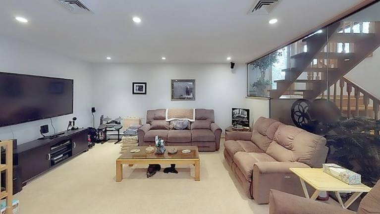 Custom three-bedroom contemporary lakefront with private dock Lower level