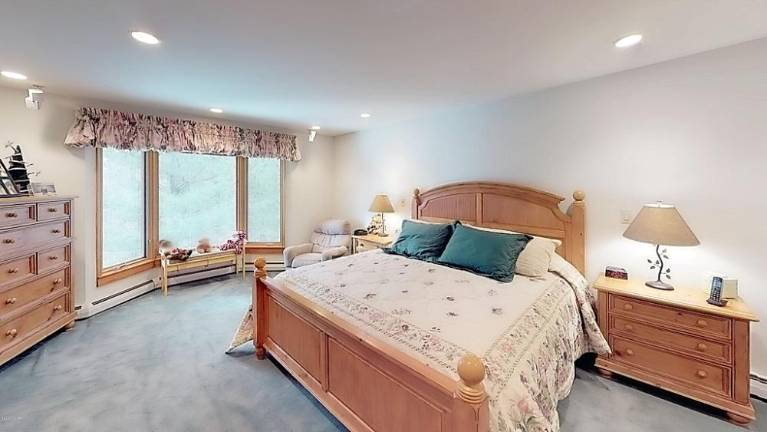Custom three-bedroom contemporary lakefront with private dock Bedroom