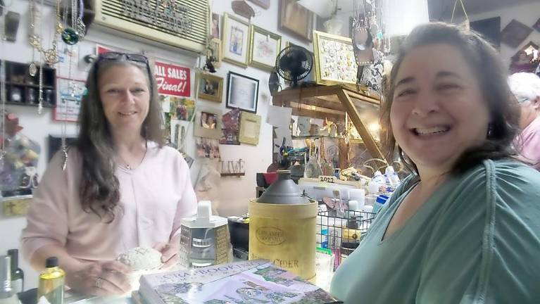 Yvonne Denaro with first-time customer Sandy Newman from Lake Hopatcong, who said she had wanted to stop by many times and that today she finally had the time. She spent $35 and said she'd be returning. (Photo by Frances Ruth Harris)