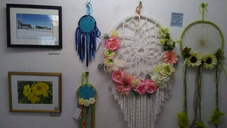 Sussex County watercolorist Eileen Izzard's paintings and portfolio are on display next to Port Jervis artist Kara Kinne's one-of-a-kind Dreamcatchers at the Milford Craft Show