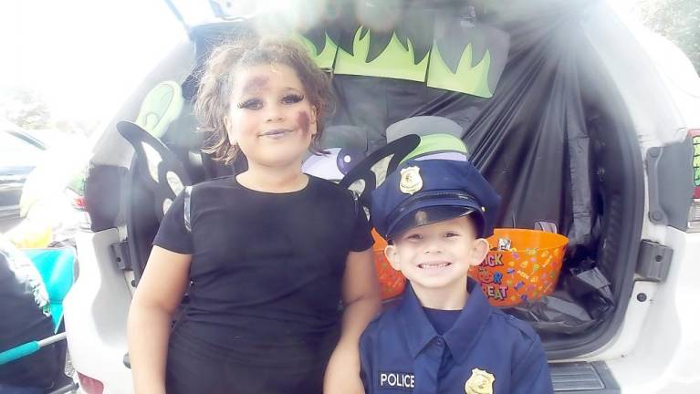 Costumed children enjoyed making the rounds at Trunk or Treat (Photo by Frances Ruth Harris)