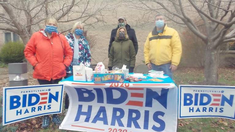The Democratic table at Dingman District 1 loaded with candy, coffee, and donuts, along with campaign literature (Photo by Frances Ruth Harris)