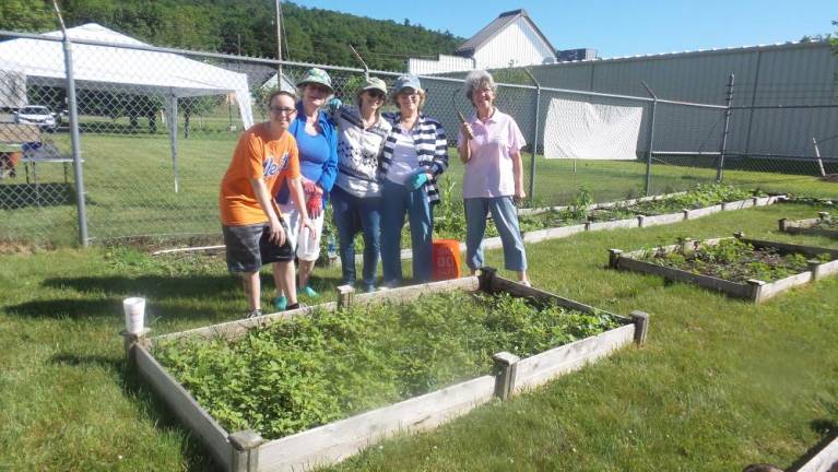 This photo from June 2017 shows Jean D'Arc, Sue Smith, Judith Casey, Sue Daley and Linda Pinto ready to weed and plant the Community Garden Project of the Milford Garden Club, which received help from the Milford Covid Relief Fund. The Community Garden delivers fresh produce to the Ecumenical Food Pantry. (File photo by Frances Ruth Harris)