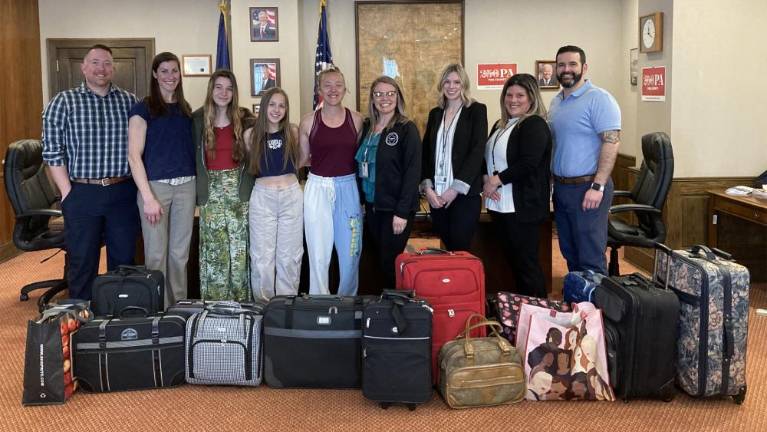 From left, Jayson Pope, Delaware Valley Supervisor of Academic Services; Amanda Pope, Delaware Valley High School National Honor Society Advisor, Levi McCollum, Helaina Stefanik, and Gabrielle Courtright, Delaware Valley High School seniors and members of the National Honor Society, Stephanie Everson, Human Services Housing Coordinator; Kayla Orben, Assistant Director of Human Services; Samantha Robayo, Pike County Family Promise Case Manager; and Robert Ruiz, Executive Director of Human Services.