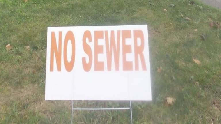 A no sewer sign in Milford (Photo by Frances Ruth Harris)