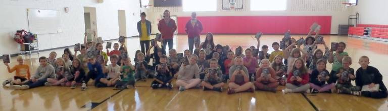 Susan Viapiano, Tom Murante and Dean Quirk, of Milford-Matamoras Rotary Club, with DVES’s third grade