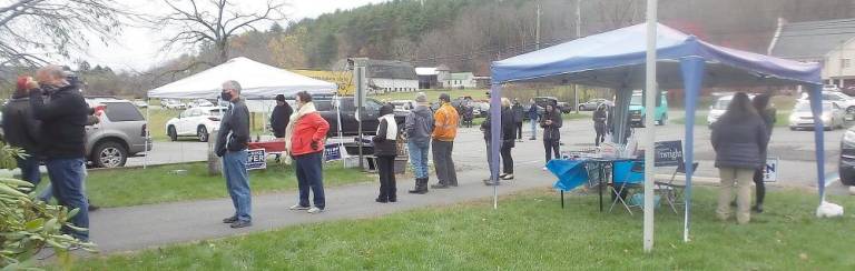 One Democratic tent and one Republican tent stood near the entrance to the Milford Township polling station offering campaign materials, coffee, donuts, and candy (Photo by Frances Ruth Harris)