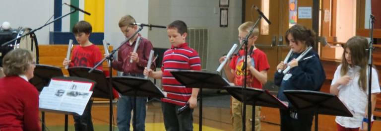 Chiming away Performing at a very special Veterans Day Ceremony held at our school this school year. Pictured are teacher Ruth Sweeney with Liam Yost, Max Kiederer, Nathaniel Harper-Lewis, Ian Lane (since moved), Gina Hanlon, and Juliette Vigilante. Not pictured is Brandon Daub.