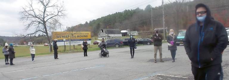 Voters in Milford Township snaked around the parking lot as they waited 30 minutes to an hour to cast their ballots (Photo by Frances Ruth Harris)