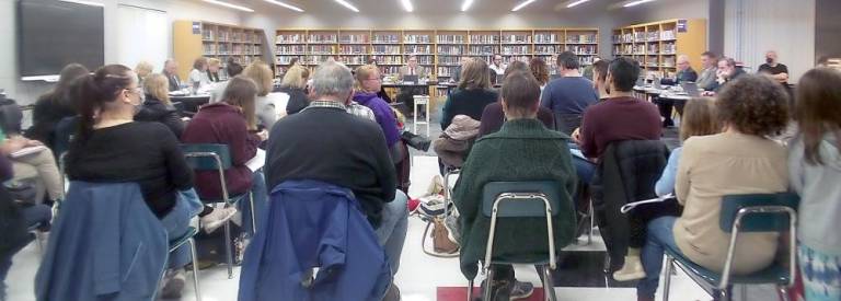 The meeting was standing room only (Photo by Frances Ruth Harris)