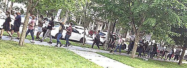 Protesters march in front of the Pike County Courthouse (Photo courtesy of Ed Gragert)