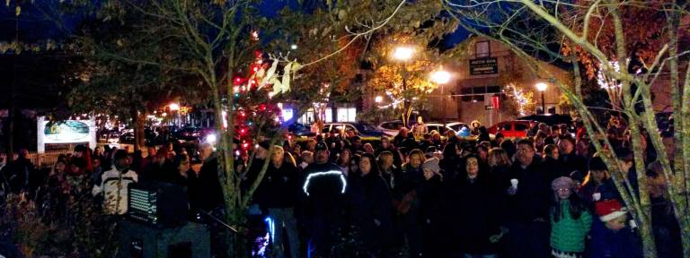 Santa arrives, the tree lights up, and all is well in Milford At least 200 people came to the annual Milford tree lighting on Community House grounds (Photo by Anya Tikka)