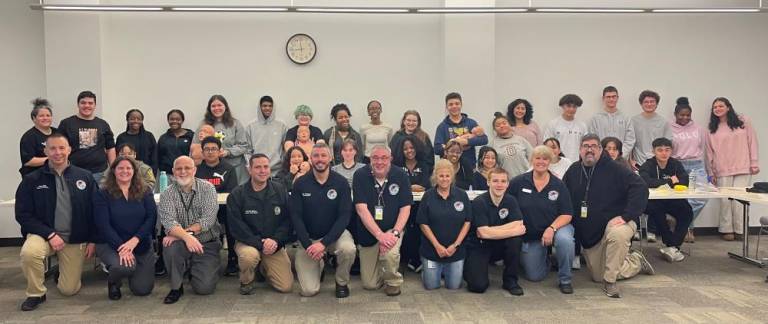 Orange County Executive Steven Neuhaus and Commissioner of Emergency Services Peter Cirigliano (center) with students at the CPR training last month.