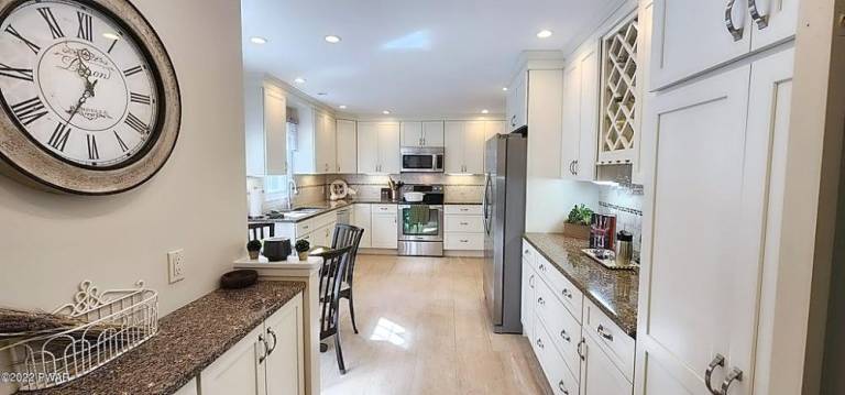 Privately set, renovated home has land, lake access and no dues Privately set, renovated home has land, lake access and no dues