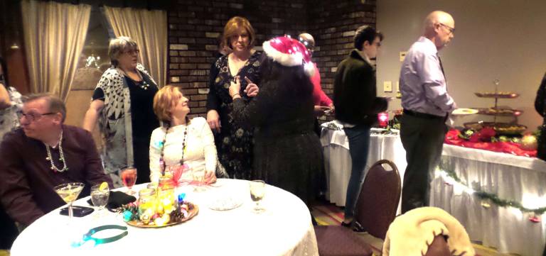 Merriment abounds at TriVersity's 'Thank You!' dance Line-up at the gourmet buffet (Photo by Frances Ruth Harris)