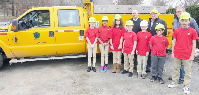 Back row (from left): business manager Charles Defebo, county manager Jeff Luongo, and safety press officer Michael Taluto; front row: Emilie Moon, Xiomara Rosario, Nadya Bermudez, Logan Clarke, Taylor Allen, Zion Colon, and David Garcia.