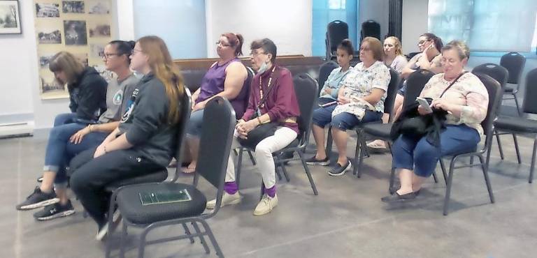 Supporters of Selina McGinnis (third row, on left, seated next to Janet Heim) turned out to Wednesday’s humane society directors’ meeting as they had to court appearances. (Photo by Frances Ruth Harris)