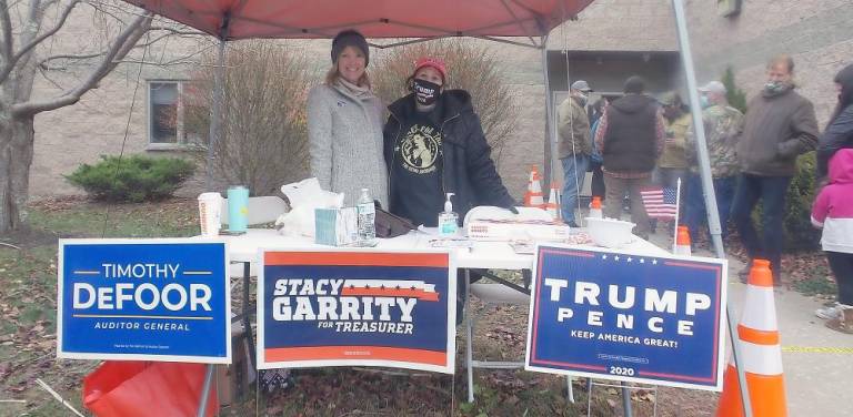 The Republican table at Dingman District 1 loaded with candy, coffee, and donuts, along with campaign literature (Photo by Frances Ruth Harris)