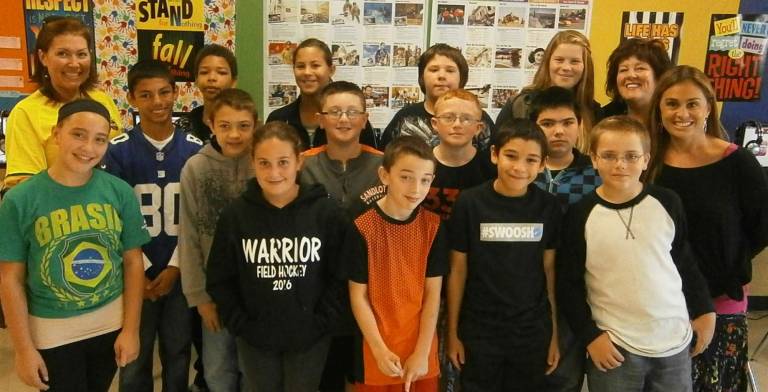 Mom shares story of immigration to America Pictured from left, front row (starting with the Warrior sweatshirt): Haylee Mosser, Steven Rizzo, Aiden Secor, and Nathan Harbeck. Second row: Giulia Casagrande, Hunter Babcock, Corey May, Damion Woodward, Nick Mele, and Mrs. Cafarella. Last row: Ms. Cabral, Carson Harlin, Shane O'Neill, Keyrah Berrios, Dylan Chuck, Mallory Petzold, and Mrs. Poltersdorf (Photo provided)