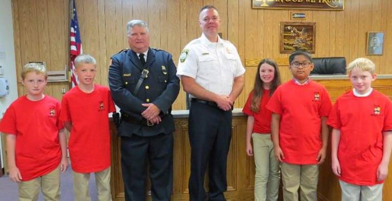 From left: Logan Clarke, William Fells, Chief Sztyndor, Chief Worden, Keira LeMay, Archit Patel, Taylor Allen