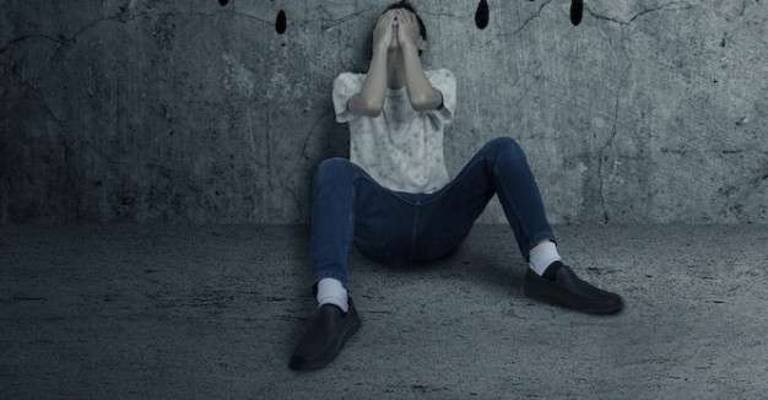 Our plan to aggressively fight the drug epidemic By Steve Guccini and David Ruby Young man getting problems, sitting and leans on wall with fear