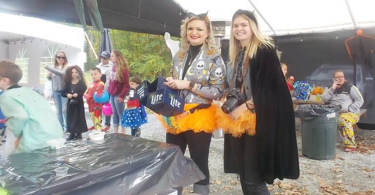 Fairy princesses mingle with ghastly ghouls at Trunk or Treat Moms enjoyed watching their kids have fun decorating pumpkins (Photo by Frances Ruth Harris)