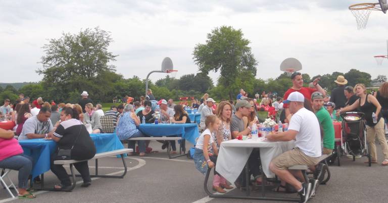 Dinner and fireworks kick off holiday weekend Serving food buffet style. The tickets for $15 were good to sample at any booth.