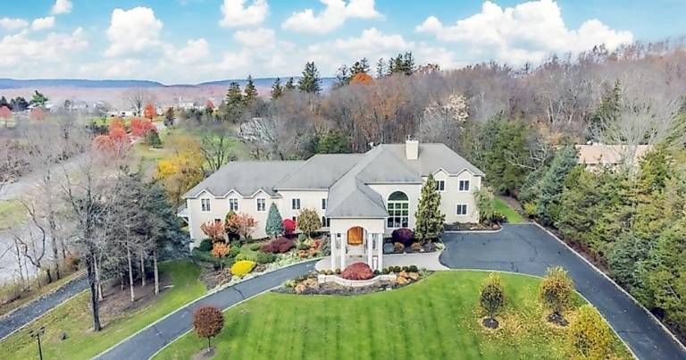 Custom estate includes car charging station, hot yoga room, and frescos Custom estate includes car charging station, hot yoga room, and frescos