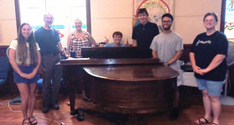 Music to the ears at Marsh Hall Braeden Ross (at the piano) with several “It’s Today“ cast members.