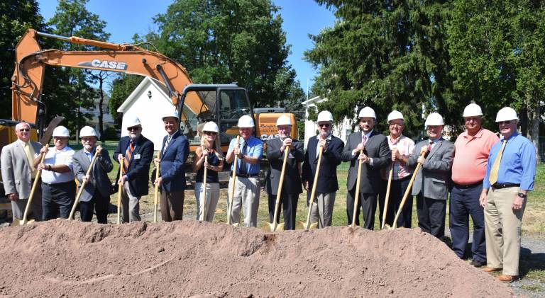 Forest City Family Health Center breaks ground Pictured (from left): Michael Clifford, chief financial officer, Wayne Memorial Hospital (WMH)/ WMCHC Board; Nicholas Cost, president, Forest City Borough Council; Attorney Hugh Rechner, first vice chair, WMH Board; Dirk Mumford, chair, WMH Board; David Hoff, CEO, WMH/ WMCHC Board; Krista Hollis, CRNP, FCFHC; David Tomazic, DO, FCFHC; Frederick Jackson, executive director, WMCHC; Peter Rodgers, chair, WMCHC Board; PA State Representative Jonathan Fritz (R); William Kerl, WMCHC Board; Robert Fortuner, finance director, WMCHC; Steve Tourje, WMCHC Board; and Walter Smith, WMCHC Board. (Photo provided)