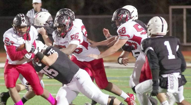 Williamsport ball carrier Lajear Whaley is grabbed by Delaware Valley defensive lineman Thomas Actisdano (75) in the first quarter.