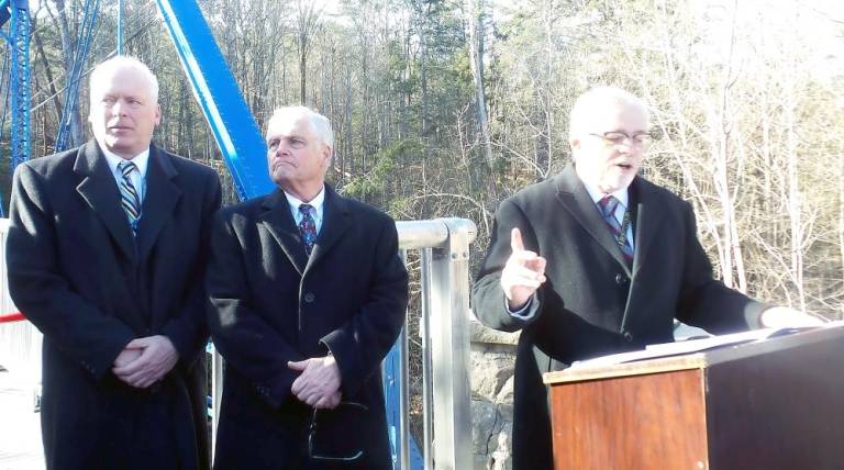 Pike County Commissioner Matt Osterberg speaks as the other commissioners, Ronald Schmalzle (left) ad Steve Guccini, listen.