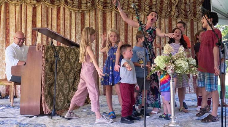 Soprano Emily Margevich singing local children at Opera! Pike! Park! held last Sunday at Ann Street Park in Milford. The singers were accompanied by Jose Melendez at piano. Photos by Marilyn Rosenthal.