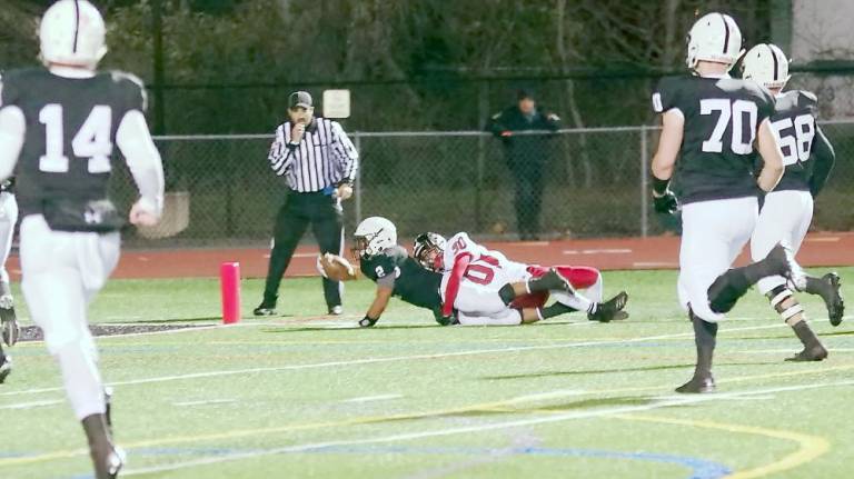 After a long gain Delaware Valley ball carrier Josh Balcarcel is brought down just short of the goal line by Williamsport defensive back Roman Morrone in the first quarter. Balcarcel rushed for 139 yards resulting in 2 touchdowns.