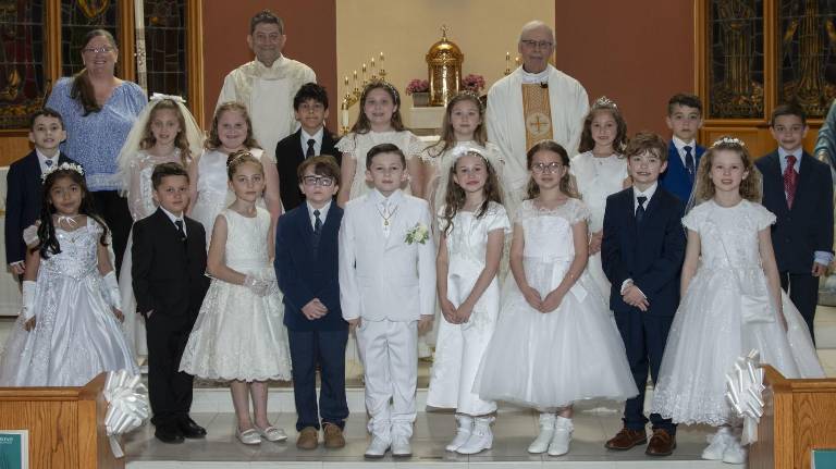 Eighteen children receive First Holy Communion St. Patrick’s communicants
