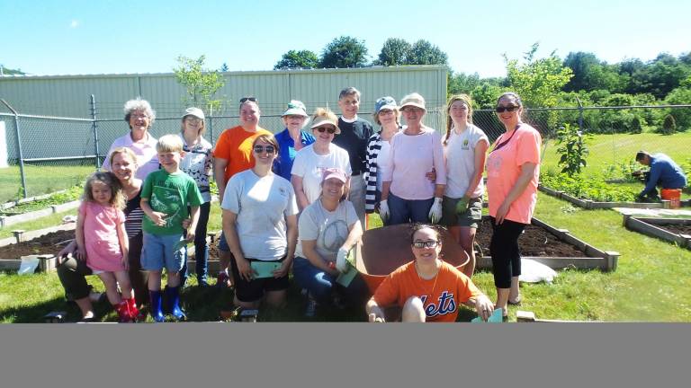 Thanks to all everyone made our garden grow this season The community garden this past season, with the Rev. Bankston of The Good Shepherd Episcopal Church, Garden Club members, and Home Depot volunteers. (Photo by Frances Ruth Harris)