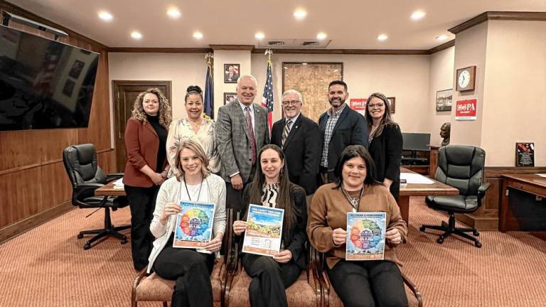 L-R Back Row: Sara Hailstone, principal at Hailstone Economic; Pike County Commissioners Christa Caceres, Ronald Schmalzle, and Matthew Osterberg; Pike County Human Services Executive Director Robert Ruiz; Pike County Human Services Housing Coordinator Stephanie Everson. L-R Front Row: Pike County Human Services Assistant Director Kayla Orben; Pamela Anslinger, director of HomeOwnership Services, NeighborWorks of Northeastern Pennsylvania; and Samantha Robayo, project coordinator, Pike County Human Services.