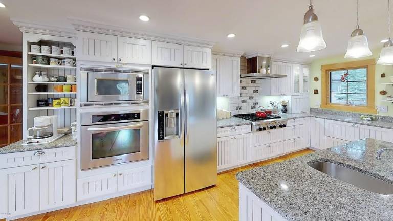 Custom three-bedroom on secluded, historic acre with lake rights Kitchen