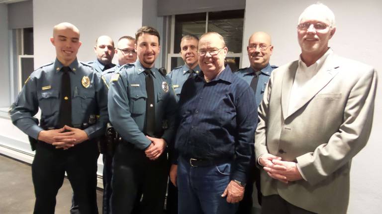The Milford Borough Police in Deccember 2014, when Jack DaSilva was promoted to chief after the retirement of the former chief, Gary Williams (from left): Sergeant Salvatore Pinzone, who was promoted to new assistant chief and will become chief on Jan. 1; Officers Jason Evers, Michael Church, and Todd Beierle; Sergeant Jason Caneron; Williams, DaSilva, and then-Mayor Bo Fean. (Photo by Frances Ruth Harris)