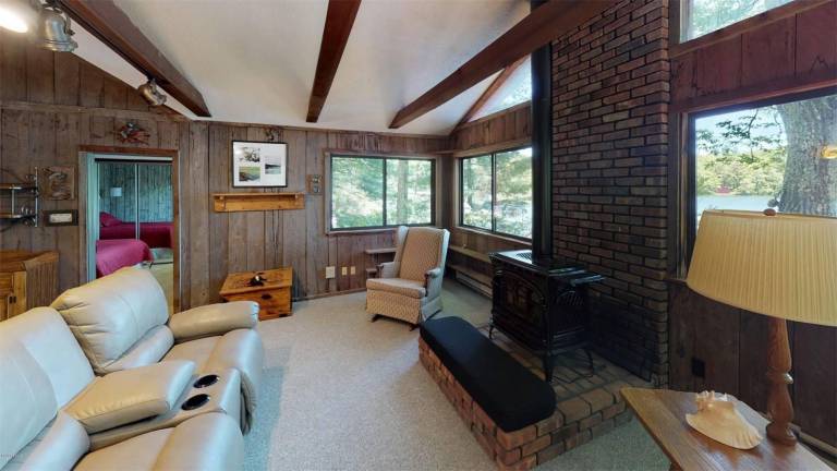 Four-bedroom lakefront contemporary is just steps from beach Living room