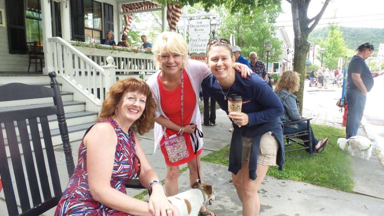 Milford honors those who sacrificed all From left: Victoria Brown, whose husband, Mike, is retired from the Air Force; Debbie Beck, wife of Milford Borough president Patrick Beck; and Amy Garrison, a nurse rock the verge before the parade (Photo by Frances Ruth Harris)