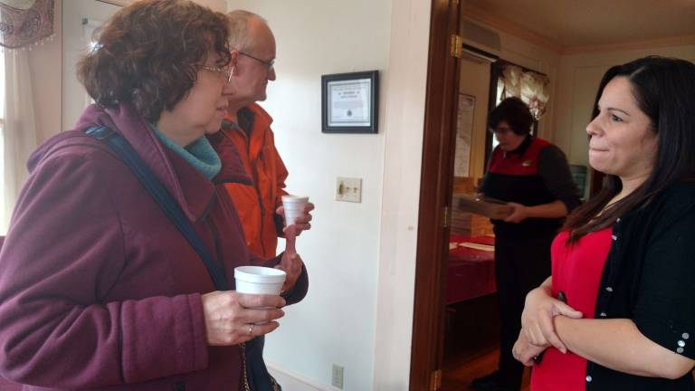 Saying thanks with pie June and Gene Dunn talk to one of the realtors, while Arlene Quirk (in background) chooses a pie (Photo by Anya Tikka)