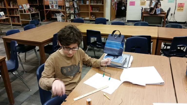 Do you have the know-how to survive in the wilderness? Lucas Tusinean works on an electromagnet (Photo provided)
