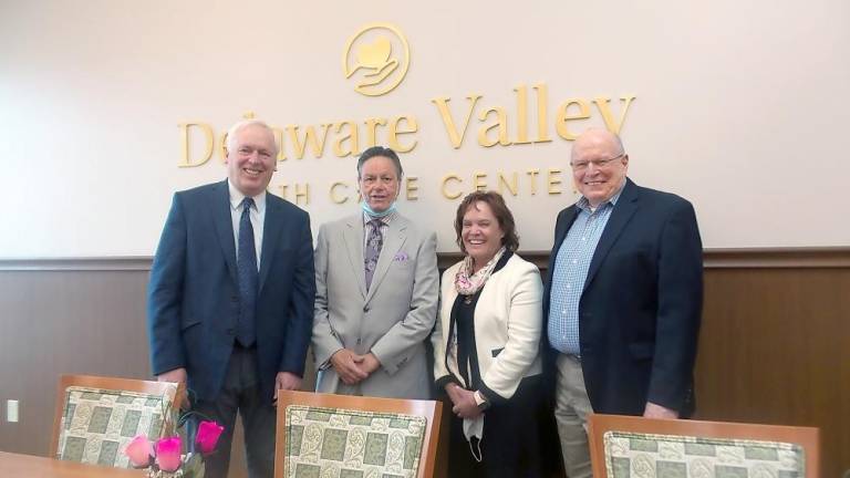 From left: Pike County Commissioner Ronald R. Schmalzle, owners Mike Kelly and Susan Keefer of Senior Health Care Solutions, and Pike County Economic Development Authority Executive Director Mike Sullivan. (Photo by Frances Ruth Harris)