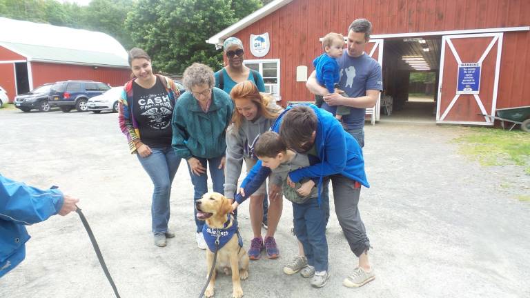 Benni hits the mark with the equine set GAIT volunteer coordinator Diana Moldovan with parents Fran Martone, Anita Wilson, Eboni Wright, Corey Ogden with baby David, Ruth Ogden and Samuel — and, of course, Benni (Photo by Frances Ruth Harris)