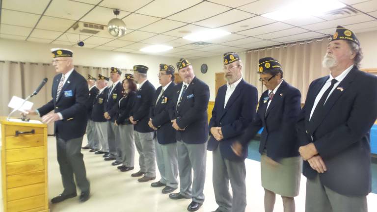 American Legion installs officers for the year to come Tim French, Deputy Commander of the 15th District, congratulates American Legion officers