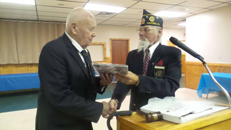 American Legion installs officers for the year to come Bill Granville, long time former commander and a Frog Man, today known as a Navy Seal, receives the first ever emeritus award given by the post. Current Commander Richard Diaz makes the presentation.